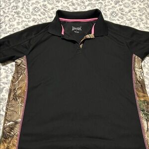Gamehide ladies’ polo shirt.
Camo print on sides and along v-neck.